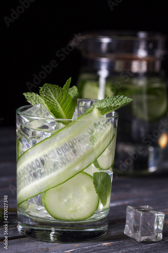 Infused cucumber drink with mint. Detox water.Selective focus