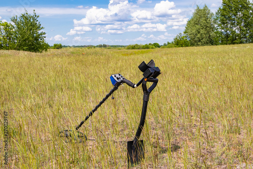 Metal detector in the field ready to work