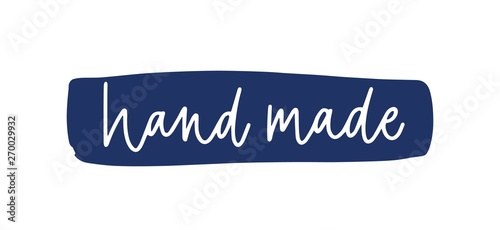 Hand Made message written on brushstroke or paint smear with cursive calligraphic font. Creative lettering for tag of handmade good isolated on white background. Flat monochrome vector illustration.