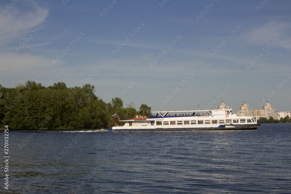 Big yacht, the ship transports people along the wide river