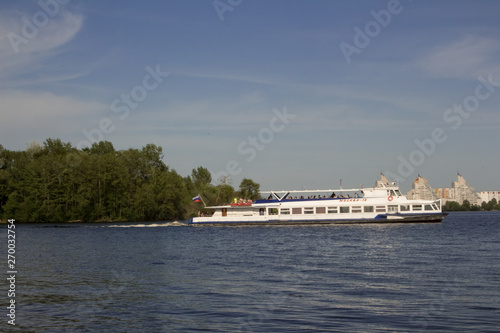 Big yacht, the ship transports people along the wide river