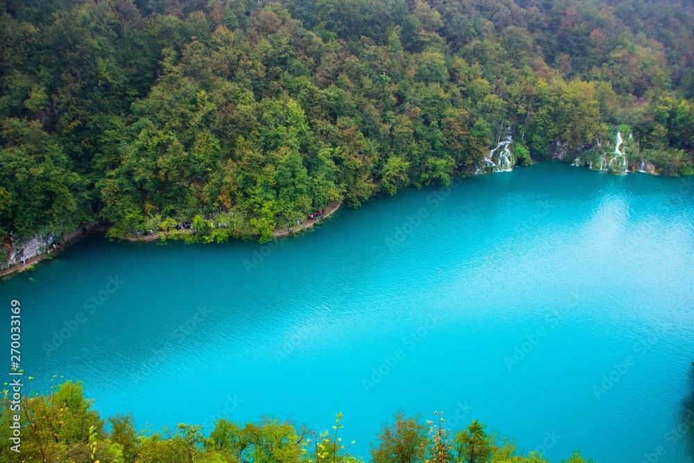 Top view of a large blue lake in Plitvice lakes national Park, Croatia.  Beautiful landscape: clean blue water, forest, waterfalls. Amazing nature  landscape, outdoor travel background. Stock Photo | Adobe Stock