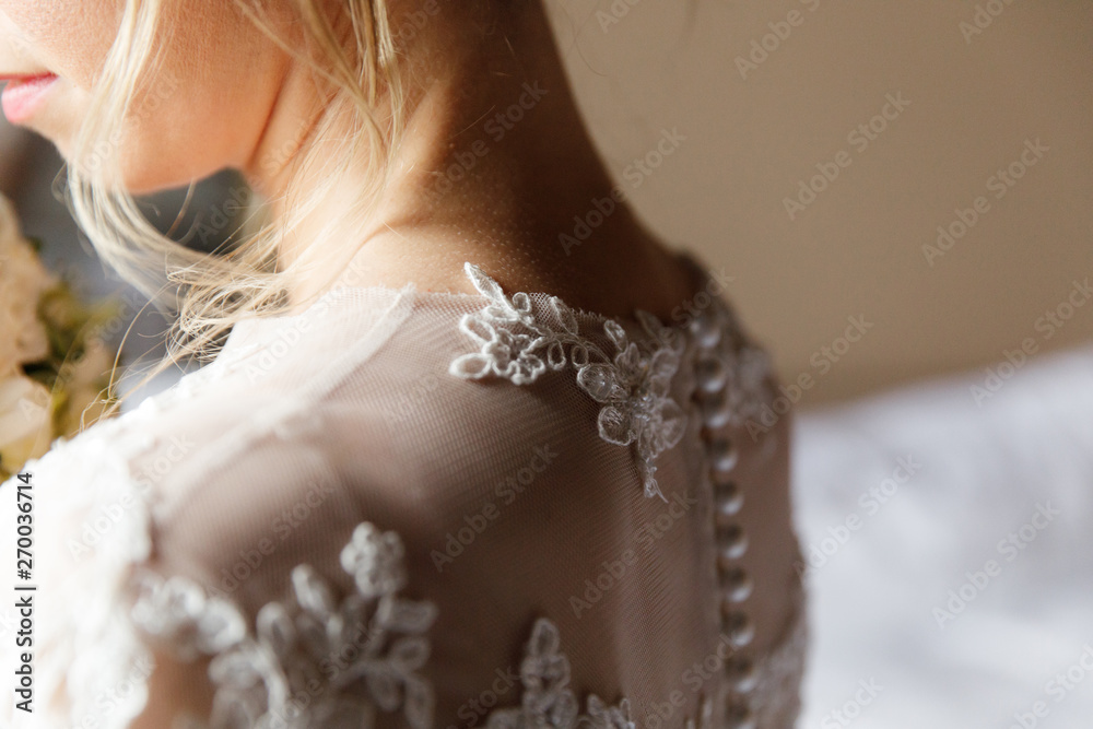 Details of the dress of the bride