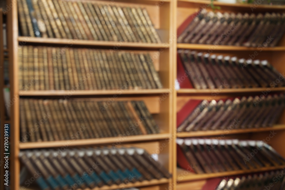 Blurred view of cabinets with books in library