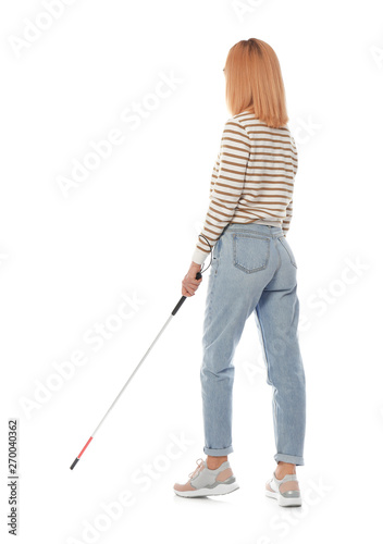 Blind person with long cane walking on white background