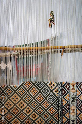 Loom in carpet shop in Kairouan city, Tunisia photo