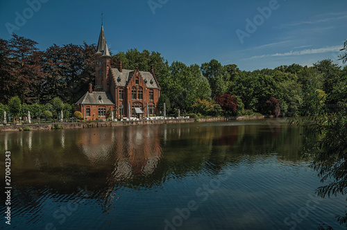 Amazing lake surrounded by greenery and old building