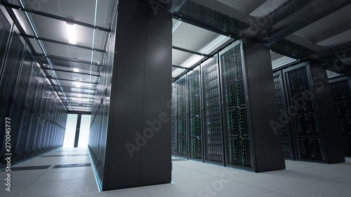 Camera moving in data center in dim light showing racks of server equipment shared by numerous passages. Seamlessly looped photorealistic 3D render animation.