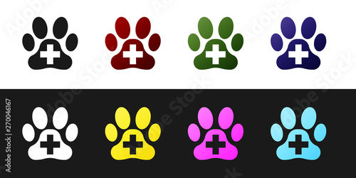 Set Veterinary clinic symbol icon isolated on black and white background. Cross hospital sign. A stylized paw print dog or cat. Pet First Aid sign. Vector Illustration
