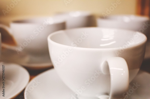 Several white ceramic coffee mugs