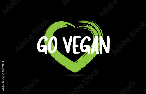 go vegan text word with green love heart shape icon on black background