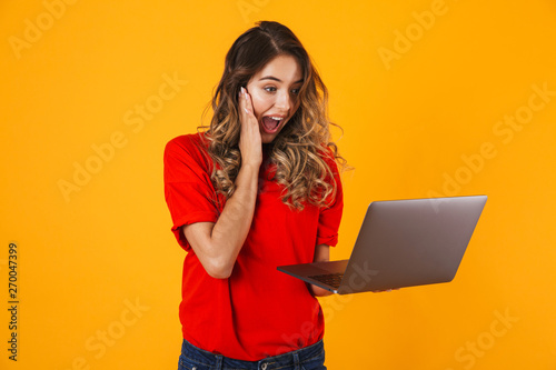 Portrait of a lovely cheerful young woman standing