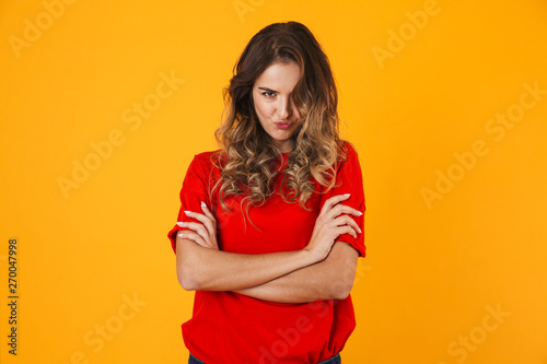 Portrait of a lovely upset young woman standing