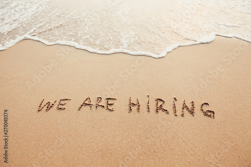 we are hiring, concept on sand