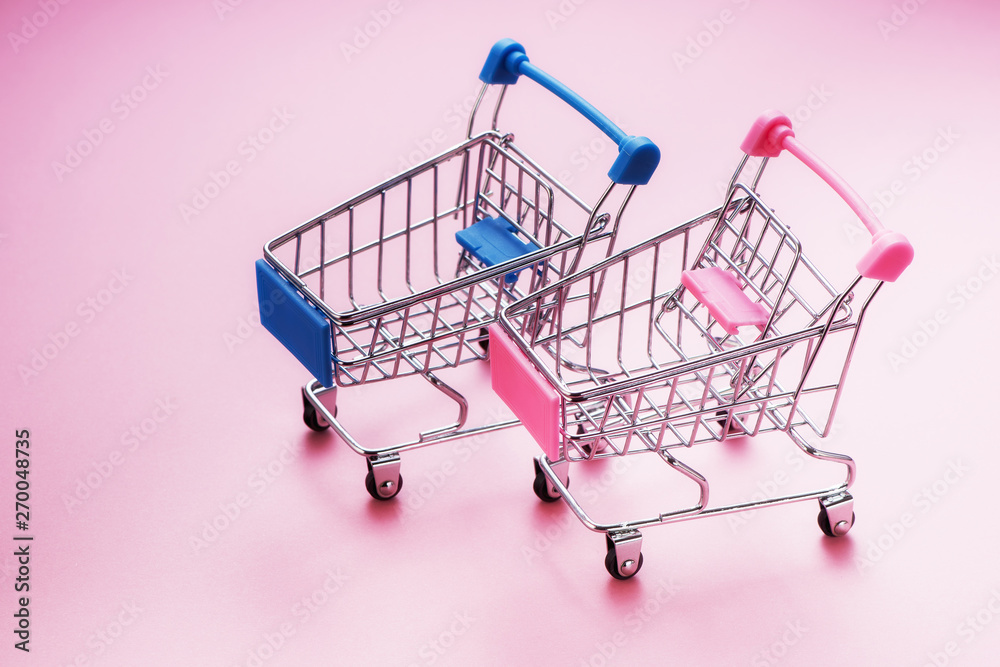 shopping carts on pink background with copy space shopping carts on pink background with copy space