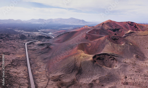 Nature panoramic landscape of volcano craters in Timanfaya national park in Lanzarote island, aerial view of Canary islans, Spain photo