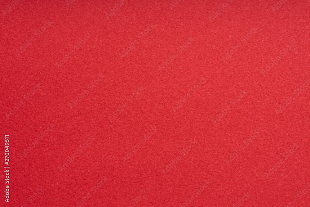 Paper background red color. Rough paper texture. Closeup. Macro. Paper background red color. Rough paper texture. Closeup. Macro.