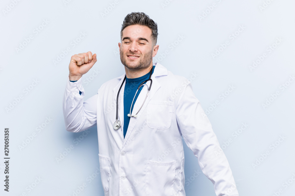 Young handsome doctor man dancing and having fun. Young handsome doctor man dancing and having fun.