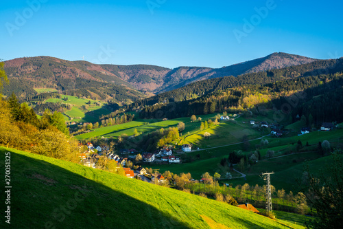 Germany, Romantic evening sunlight in valley of high black forest village in springtime