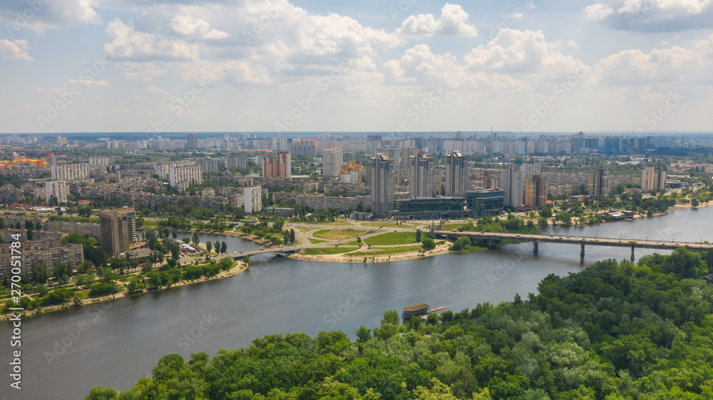 Aerial top view photo from drone of coastline, skyline and cityscape of Dnieper River near Rusanivka island at summer time. (Kyiv, Kiev) Ukraine.