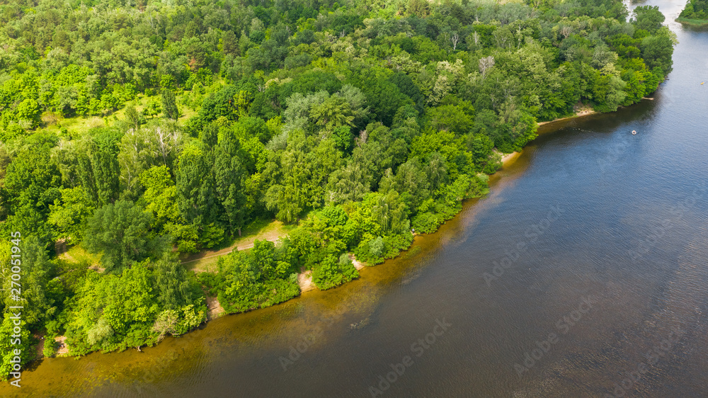 Aerial top down view from drone of forest on river coastline. Natural green foliage background. Aerial top down view from drone of forest on river coastline. Natural green foliage background.