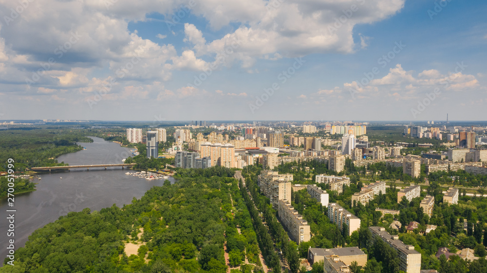 Birds eye view on cityscape, skyline and coastline of Dnieper River near Rusanivka island at summer time. (Kyiv, Kiev) Ukraine.