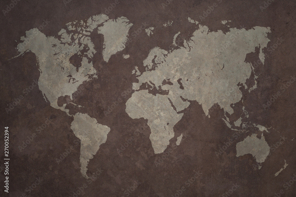 Fototapeta premium Grunge world map made with a planisphere overlaid with grungy elements, dark seas and light lands version