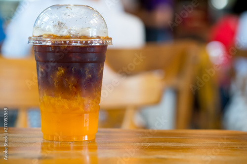 Orange juice espresso with ice. Ice cold summer drink.