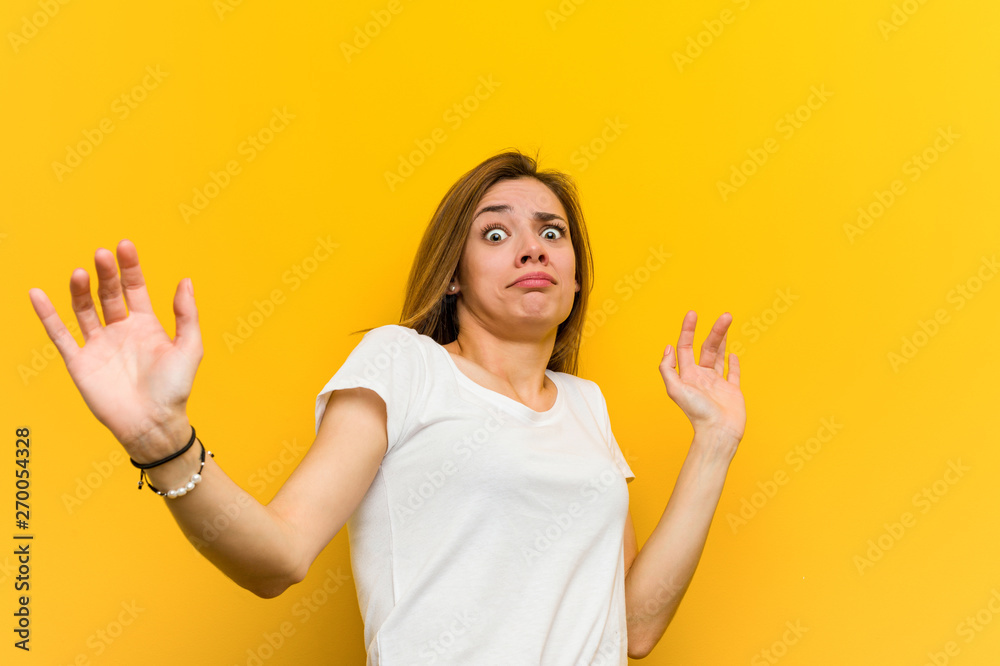 Young natural caucasian woman being shocked due to an imminent danger Young natural caucasian woman being shocked due to an imminent danger