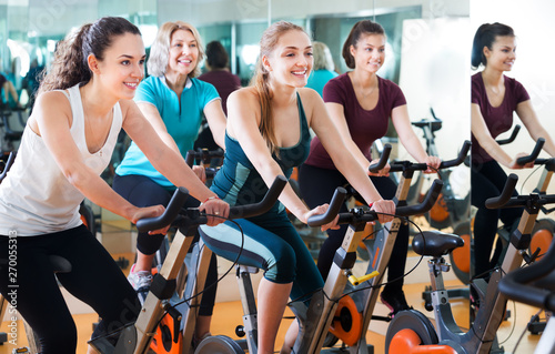 Females training on exercise bikes © JackF