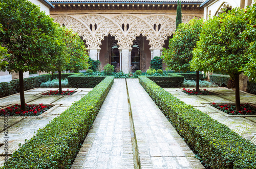 Zaragoza, Aragon, Spain - February 14th, 2019 : Courtyard of Santa Isabel inside the Moorish Taifal Aljafería Palace Unesco World Heritage Site.