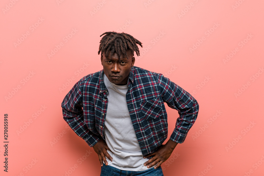 Young african black man scolding someone very angry. Young african black man scolding someone very angry.