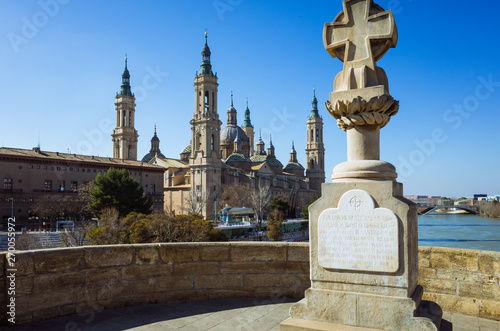 Zaragoza, Aragon, Spain - February 14th, 2019 : Basilica of Our Lady of the Pillar as seen from the Puente de Piedra (Stone bridge) over the river Ebro.  © Luis Dafos