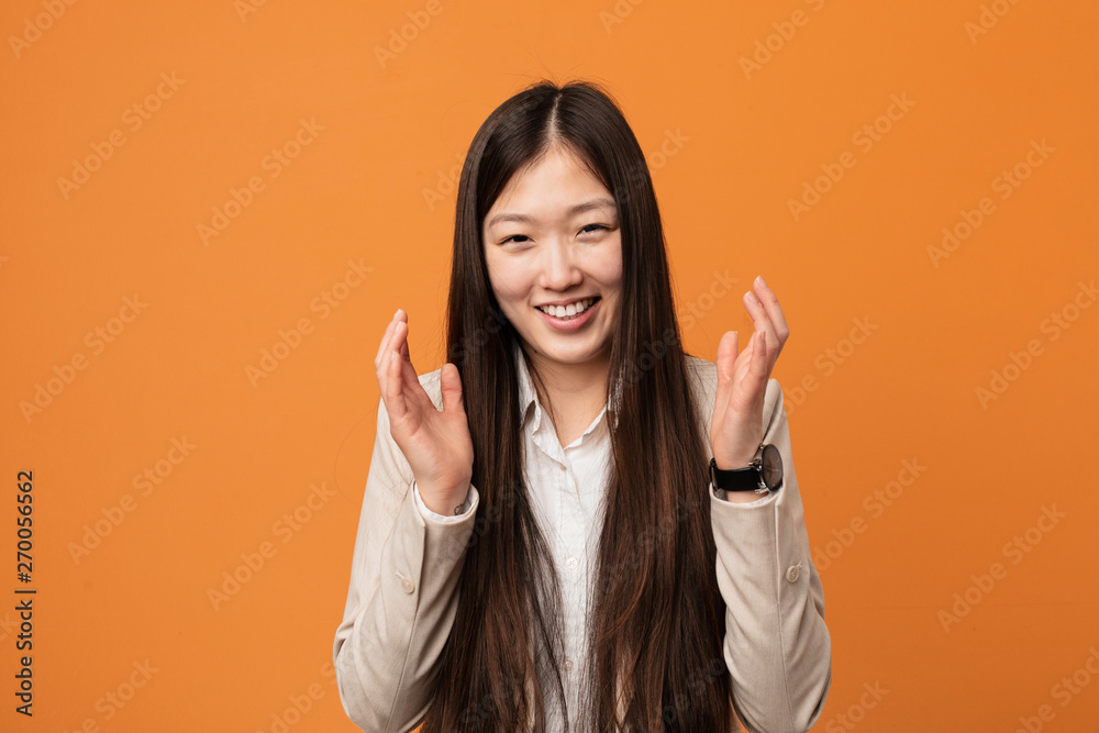 Young business chinese woman joyful laughing a lot. Happiness concept. Young business chinese woman joyful laughing a lot. Happiness concept.