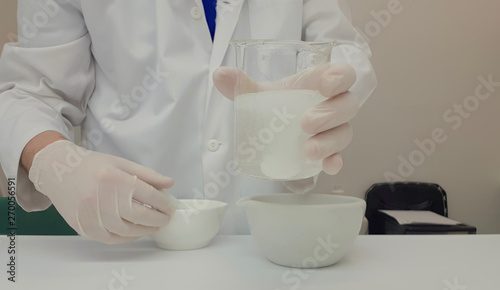 Pharmacist performing a quality control of effervescent tablets