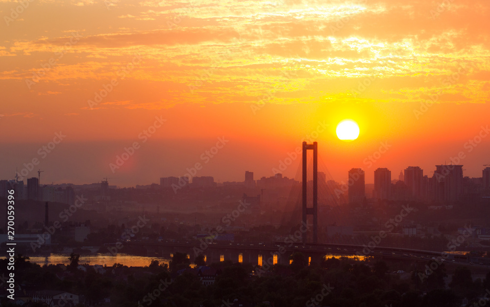 Big bridge in the city at sunset