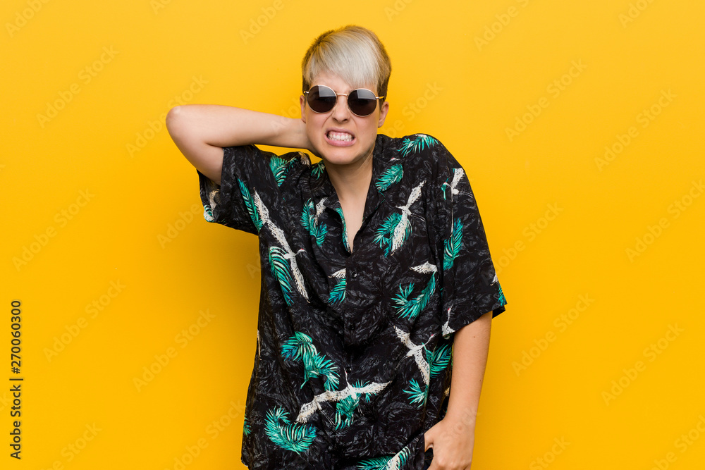 Young curvy woman wearing a summer look touching back of head, thinking and making a choice. Young curvy woman wearing a summer look touching back of head, thinking and making a choice.