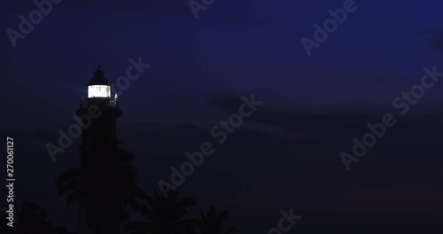 Night seascape with lighthouse