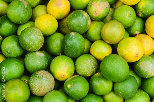 Lime background, yellow and green fresh limes background