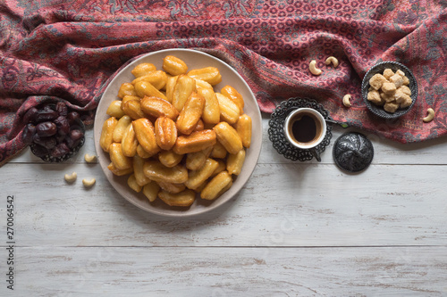 Ramadan sweets are laid out on the table.  photo