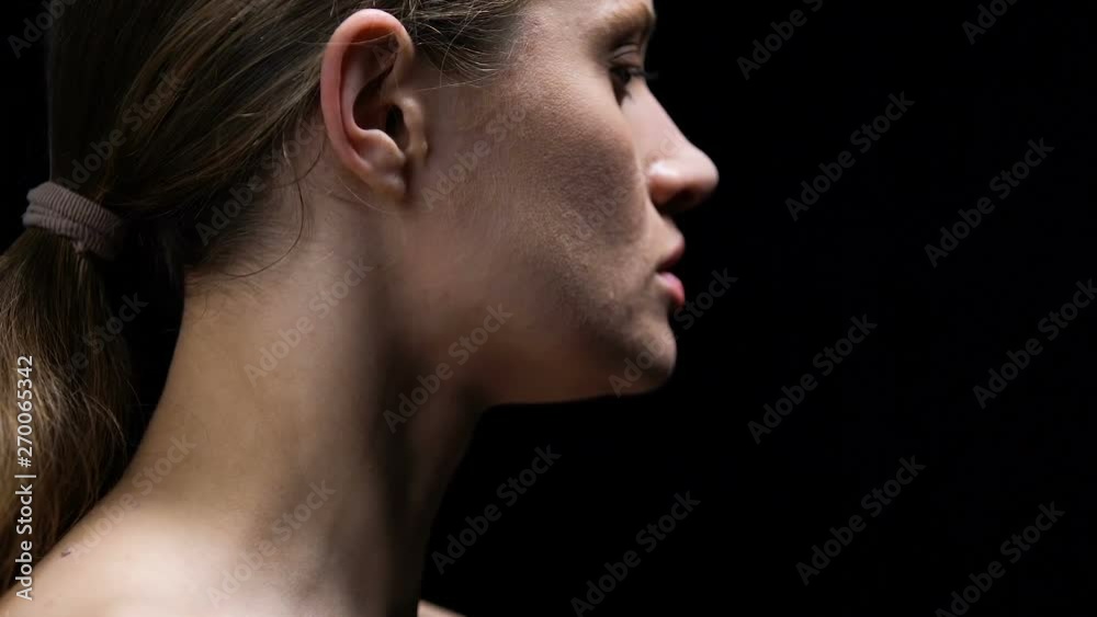 Woman tearing frigid label from ear, protest female humiliation and offence Woman tearing frigid label from ear, protest female humiliation and offence