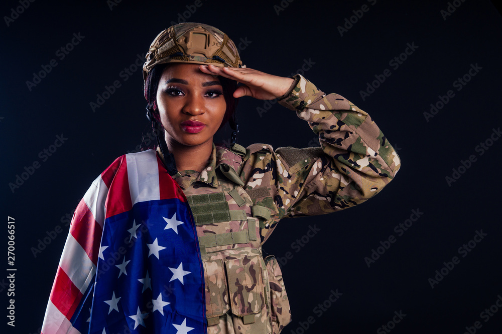 Young latin indian woman soldier with gun studio black background Young latin indian woman soldier with gun studio black background