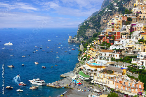 Positano along the Amalfi Coast of Italy. Above view of the port and colorful town buildings.