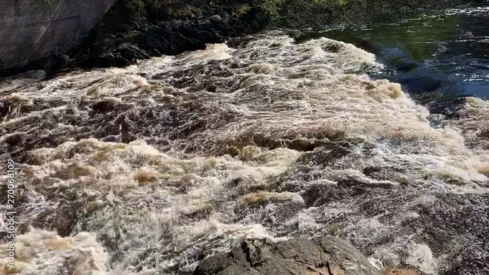 Girvas volcano became waterfall at high water time in Karelia, Russia Girvas volcano became waterfall at high water time in Karelia, Russia