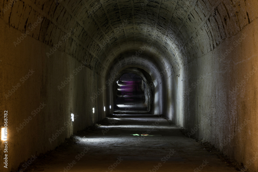 A dark, deserted underground tunnel