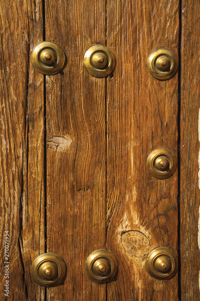 Bronze studs attached to wooden planks at Caceres Bronze studs attached to wooden planks at Caceres