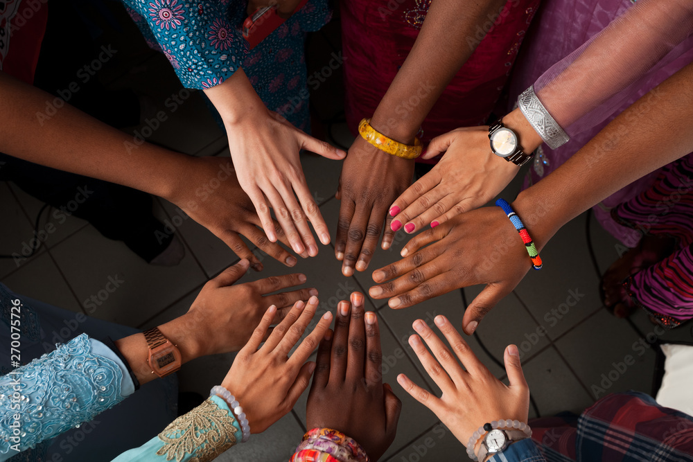 Obraz premium Hands of happy group of African people which stay together in circle