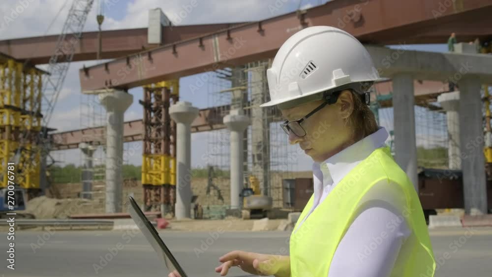 accountant makes estimate on construction site using laptop. Close-up. accountant makes estimate on construction site using laptop. Close-up.