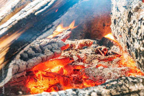 Firewood in flame close-up stock photography