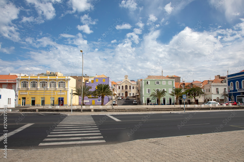 Colonial houses and crosswalk, pedestrian crossing in Mindelo on the island of Sao Vicente in Cape Verde,a beautiful clouded sky.